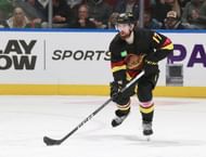 Filip Hronek of the Vancouver Canucks skates up ice during their NHL game against the Tampa Bay Lightning at Rogers Arena on December 12, 2023 in...